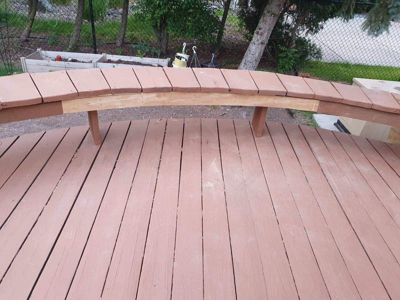 Built-in bench seating integrated into a deck railing