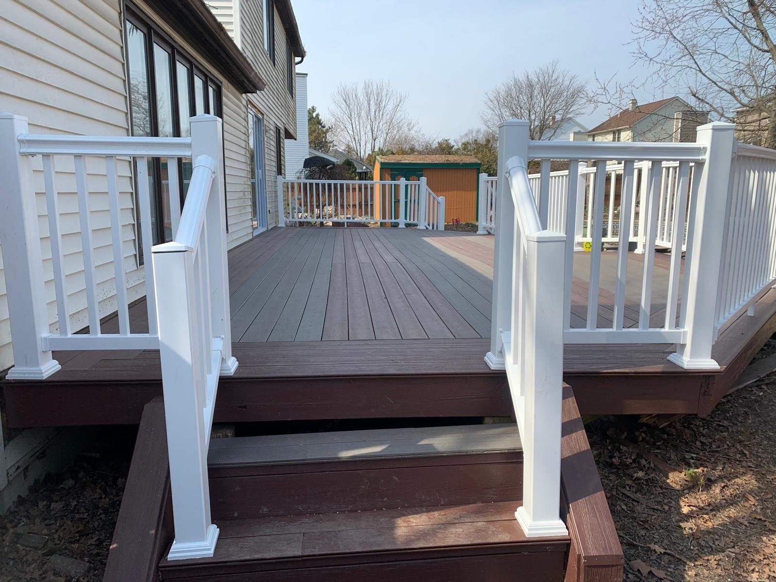 Composite deck build with stairs and railing
