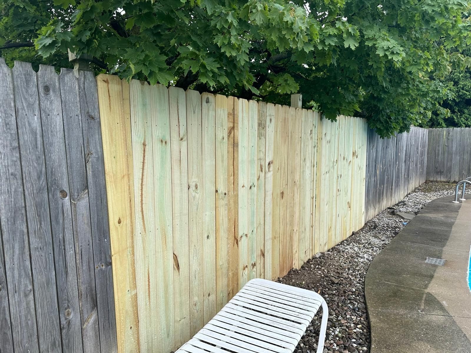 Tall wood privacy fencing panels in a Buffalo backyard